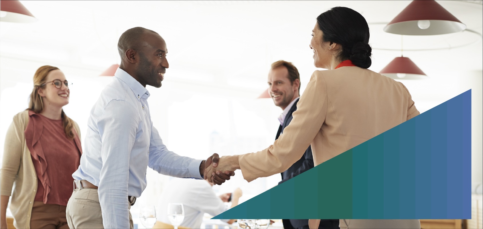 Businessman greeting potential clients at a restaurant 